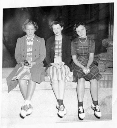 1940s Vintage Photo of three girls in plaid dresses wearing saddle shoes. 