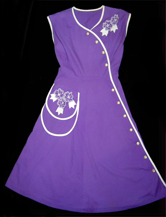 1950's house dress in purple with asymetrical design. 1950s fashion.