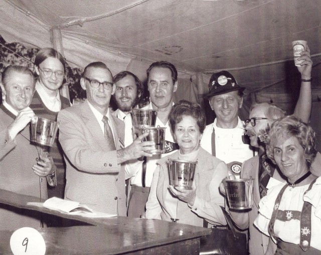 I'm thinking this image is from the 1970s at the Cinncinnati Germania Society Oktoberfest. Everyone is holding up special steins for the photo. 