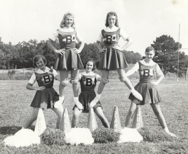 1960s vintage photo of 1960s cheerleaders in 1960s Cheerleading uniforms. 