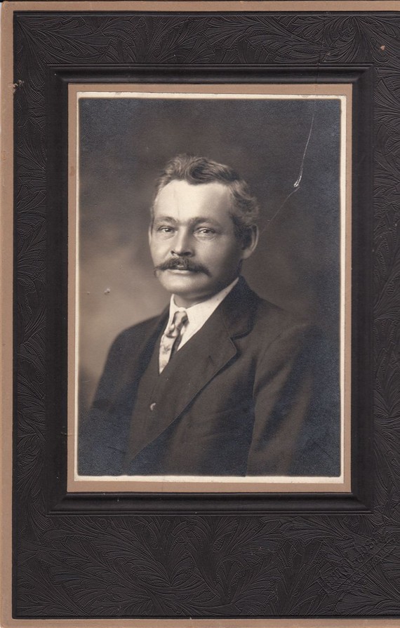 1920s vintage photo of a man with a mustache. 
