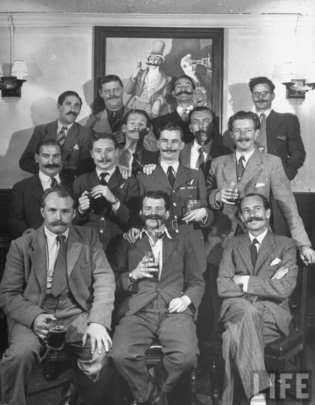 1940s vintage photo of the Members of Handlebar Club (mustache club ) posing for photograph, UK, July 1947. 