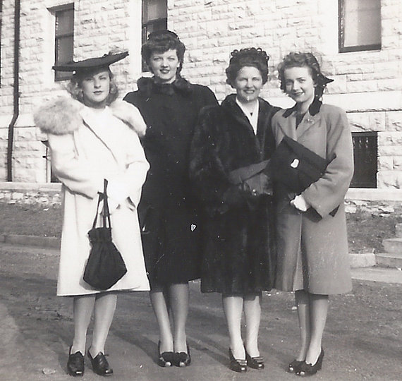1940s vintage photo of a four 1940s women in 1940s winter coats and 1940s hats. Stunning 1940s fashions! 