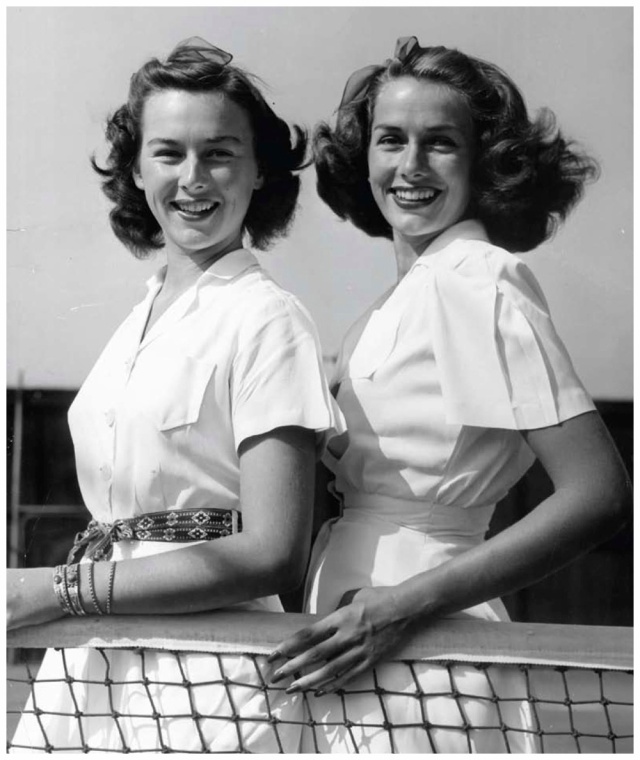 1940s vintage photo of Jinx Falkenburg tennis star in 1949 posing for a photo in  1940s tennis outfit. 