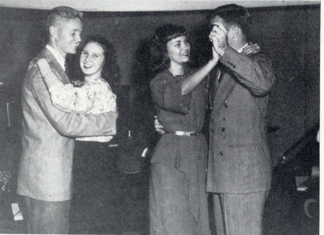 1940s vintage photo of two couples in college / university dancing together at a school dance. 